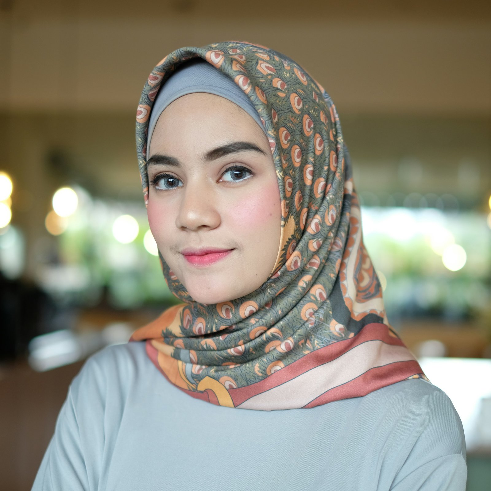 Woman wearing gray hijab